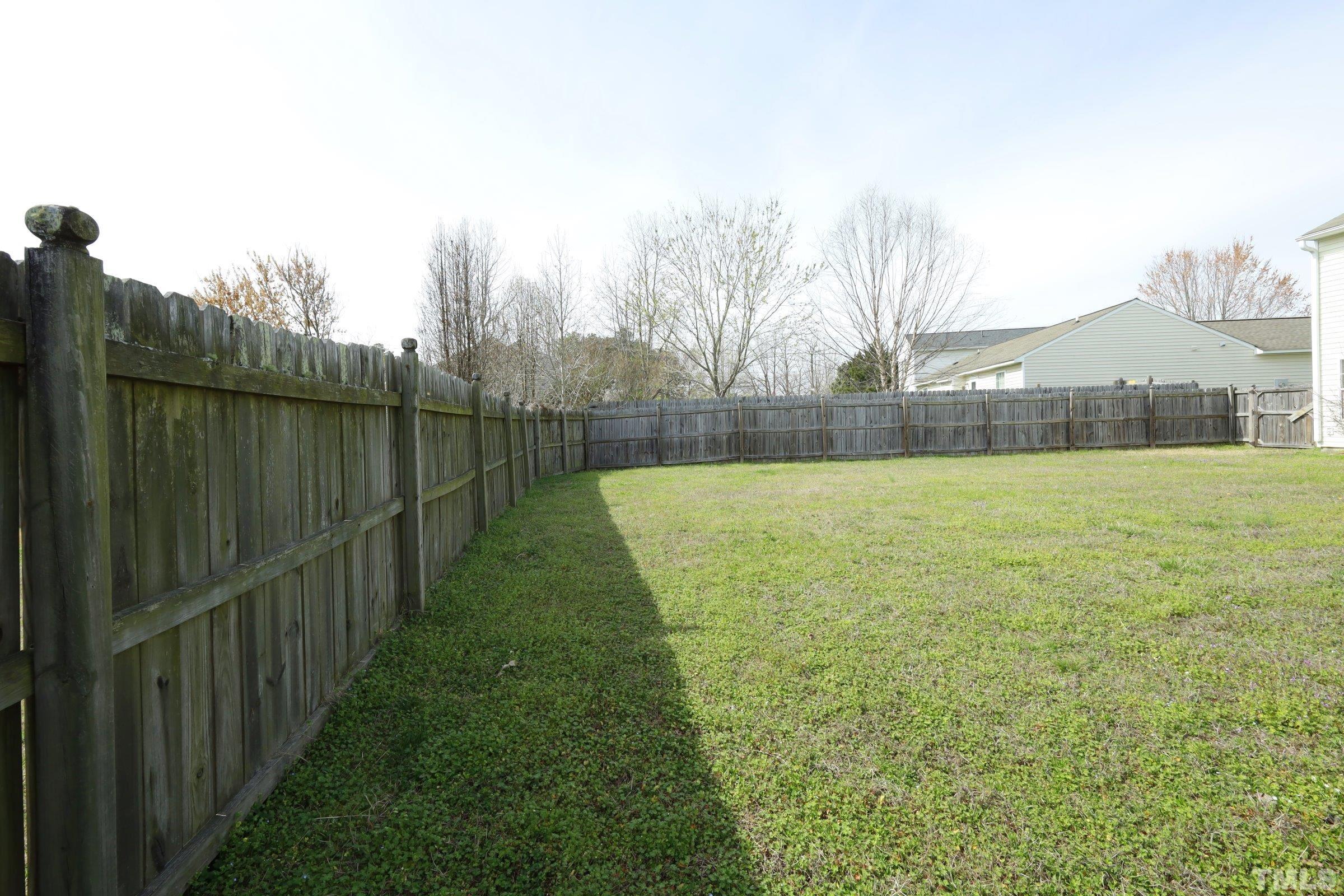 4014 Springfield Creek Drive Raleigh, NC 27616 - Photo 33 of 36 a view of a pathway with a wrought fence