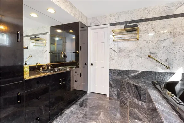a kitchen with granite countertop a sink and cabinets
