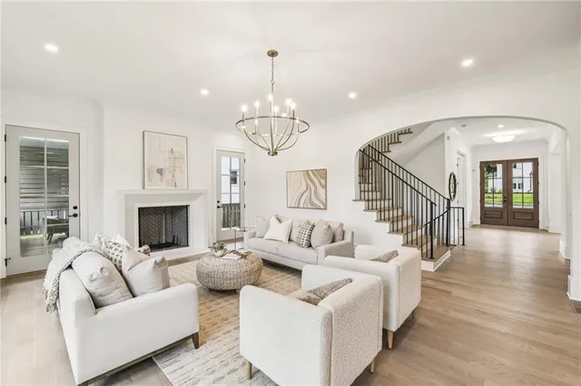 a living room with furniture and a fireplace