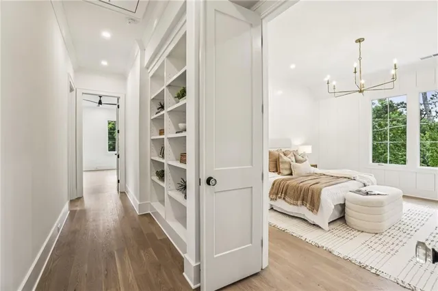 a large white tub sitting next to a bathroom sink