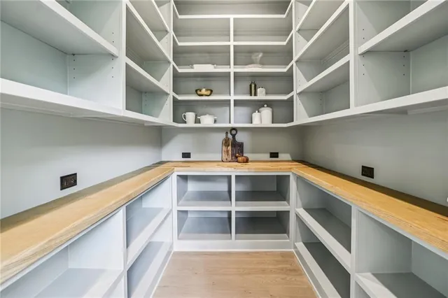 a living room with furniture ceiling fan and a chandelier
