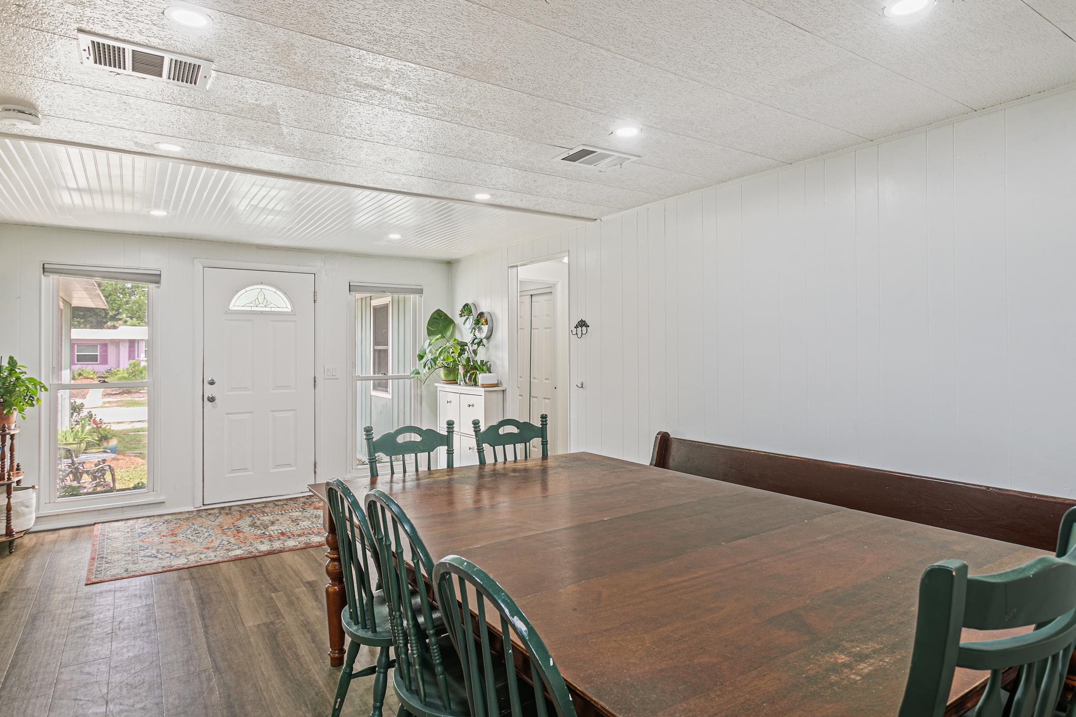 963 Catalina Road St. Augustine, FL 32086 - Photo 16 of 59 a view of a dining room with furniture and wooden floor