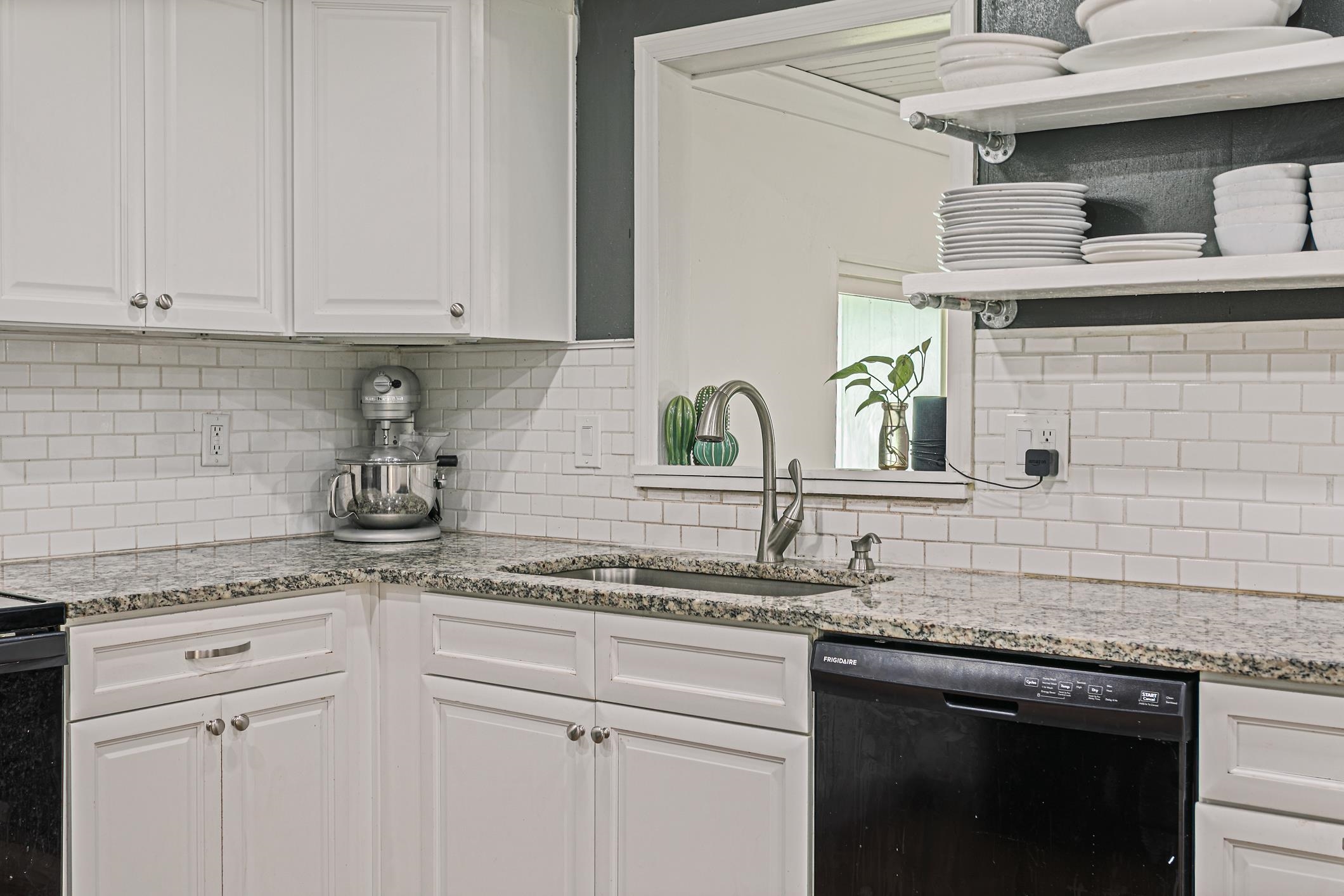 963 Catalina Road St. Augustine, FL 32086 - Photo 17 of 59 a kitchen with stainless steel appliances granite countertop white cabinets and a sink