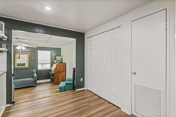 a view of a livingroom from a hallway