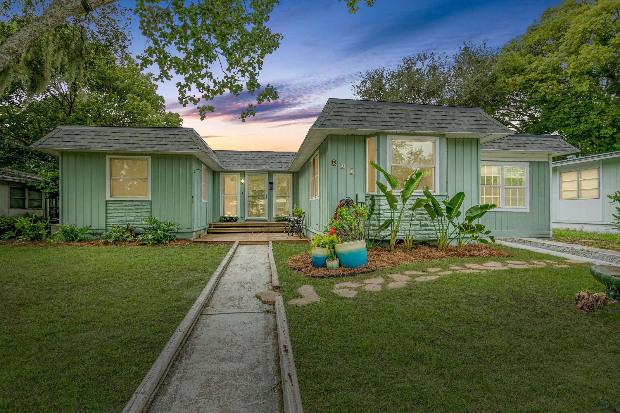 963 Catalina Road St. Augustine, FL 32086 - Photo 2 of 59 a front view of a house with garden