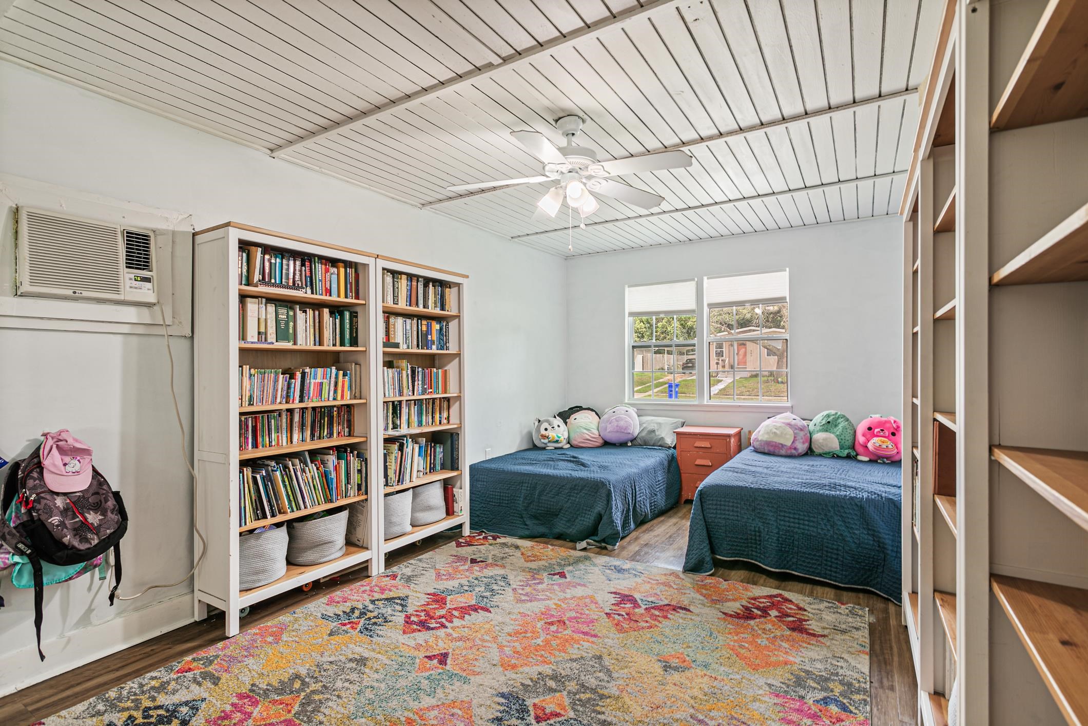 963 Catalina Road St. Augustine, FL 32086 - Photo 22 of 59 a bedroom with bed and a book shelf
