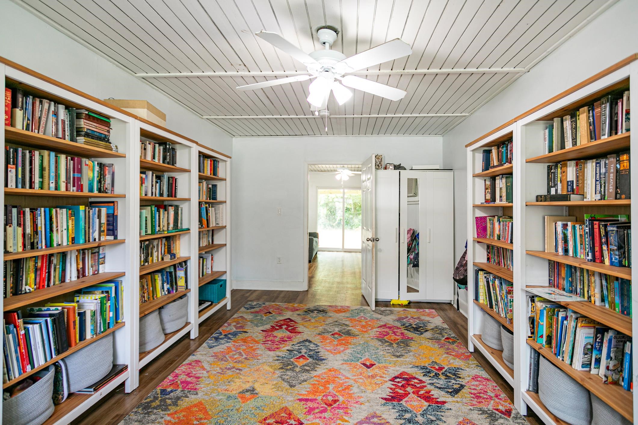963 Catalina Road St. Augustine, FL 32086 - Photo 23 of 59 a bedroom with a bed and a book shelf