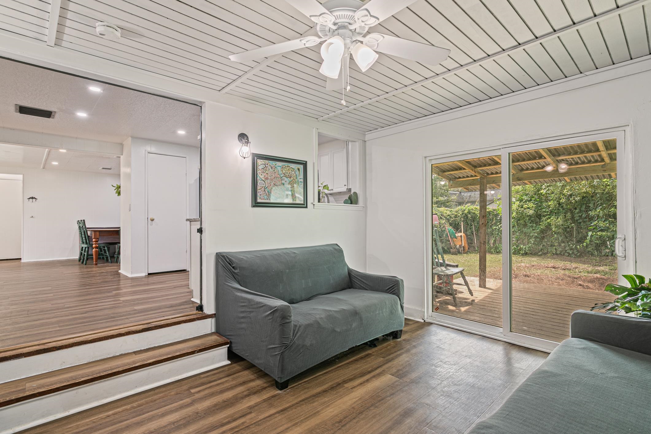 963 Catalina Road St. Augustine, FL 32086 - Photo 24 of 59 a living room with furniture and a floor to ceiling window