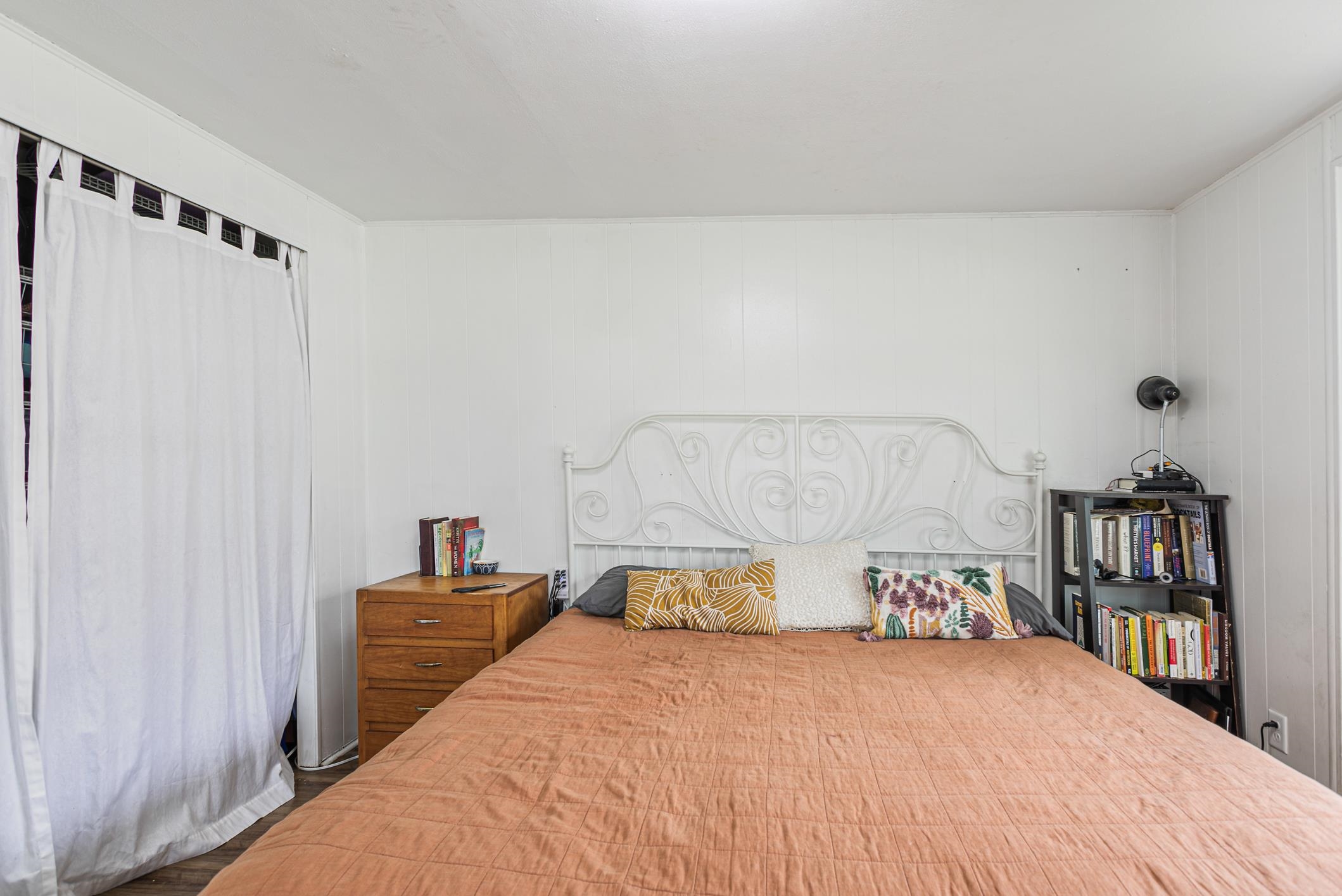 963 Catalina Road St. Augustine, FL 32086 - Photo 29 of 59 a bedroom with a large bed and a book shelf