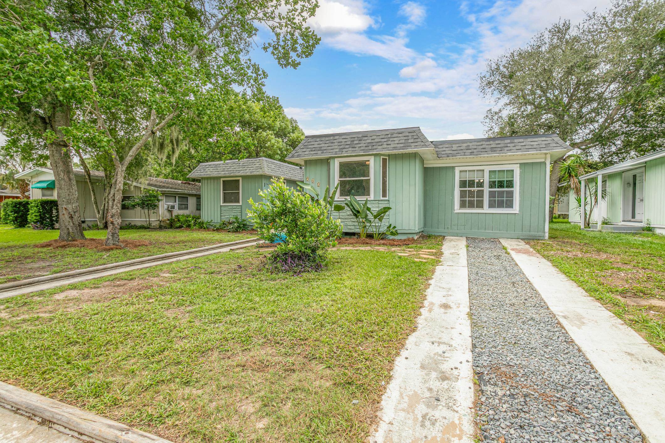 963 Catalina Road St. Augustine, FL 32086 - Photo 3 of 59 a front view of a house with a yard