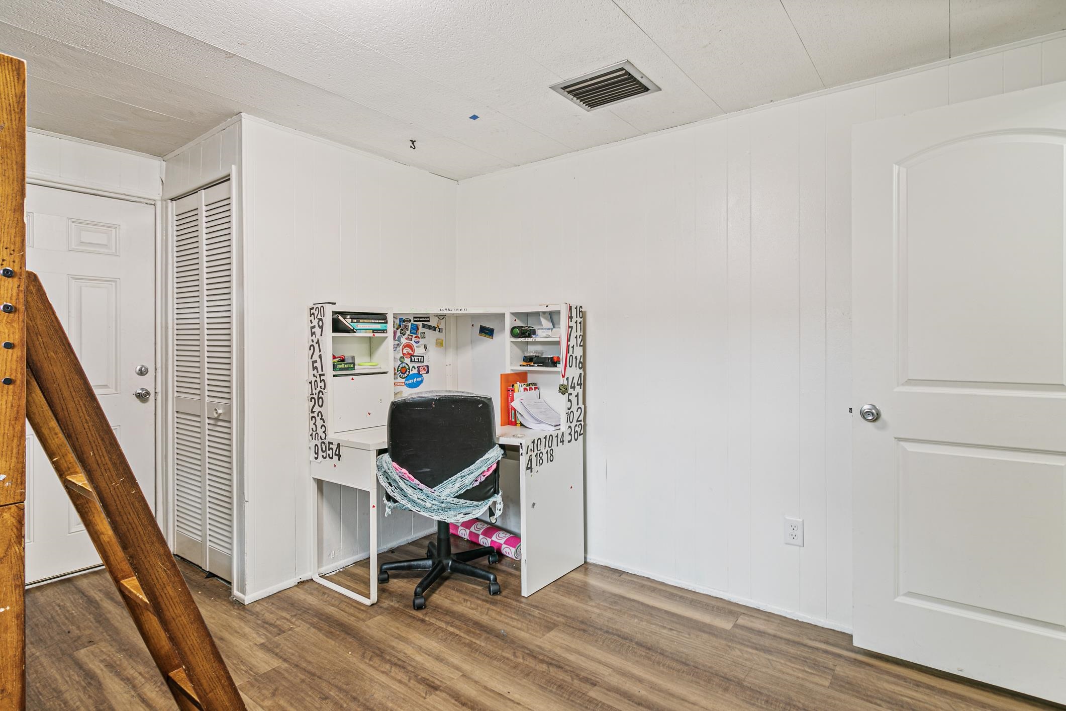 963 Catalina Road St. Augustine, FL 32086 - Photo 5 of 59 a view of a room with wooden floor and furniture