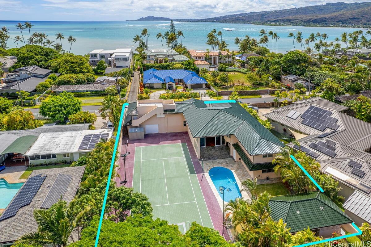an aerial view of a house with a swimming pool