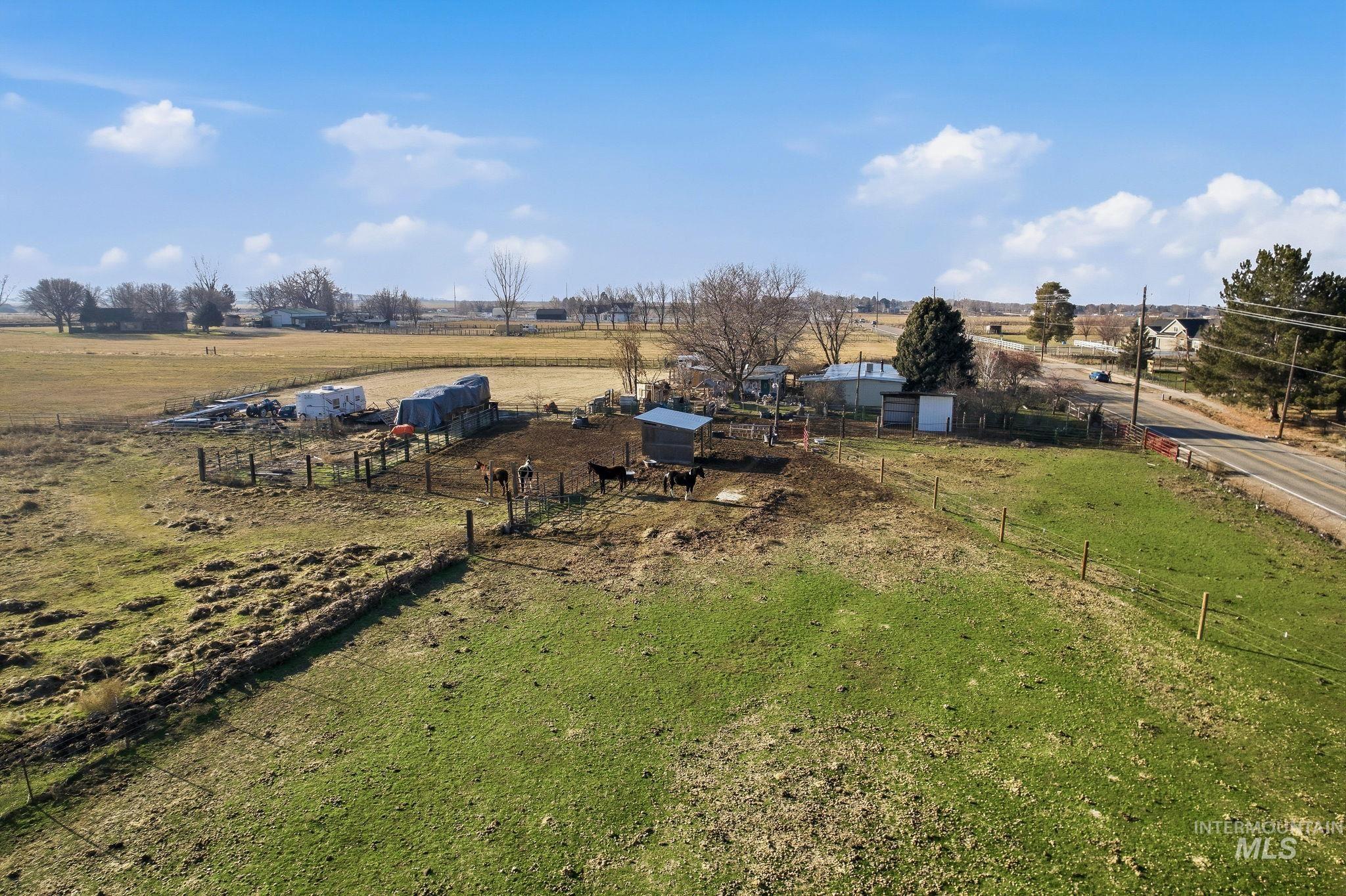 603 East King Road Kuna, ID 83634 - Photo 13 of 22 View of yard with a view of countryside and an outbuilding
