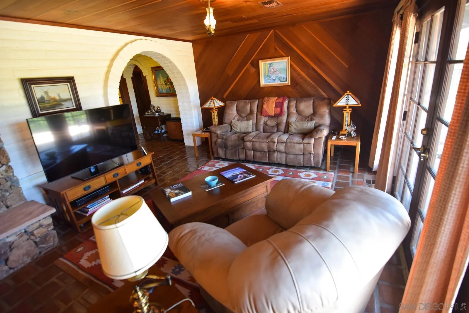 23684 Viejas Grade Road Descanso, CA 91916 - Photo 12 of 54 a living room with furniture and a flat screen tv