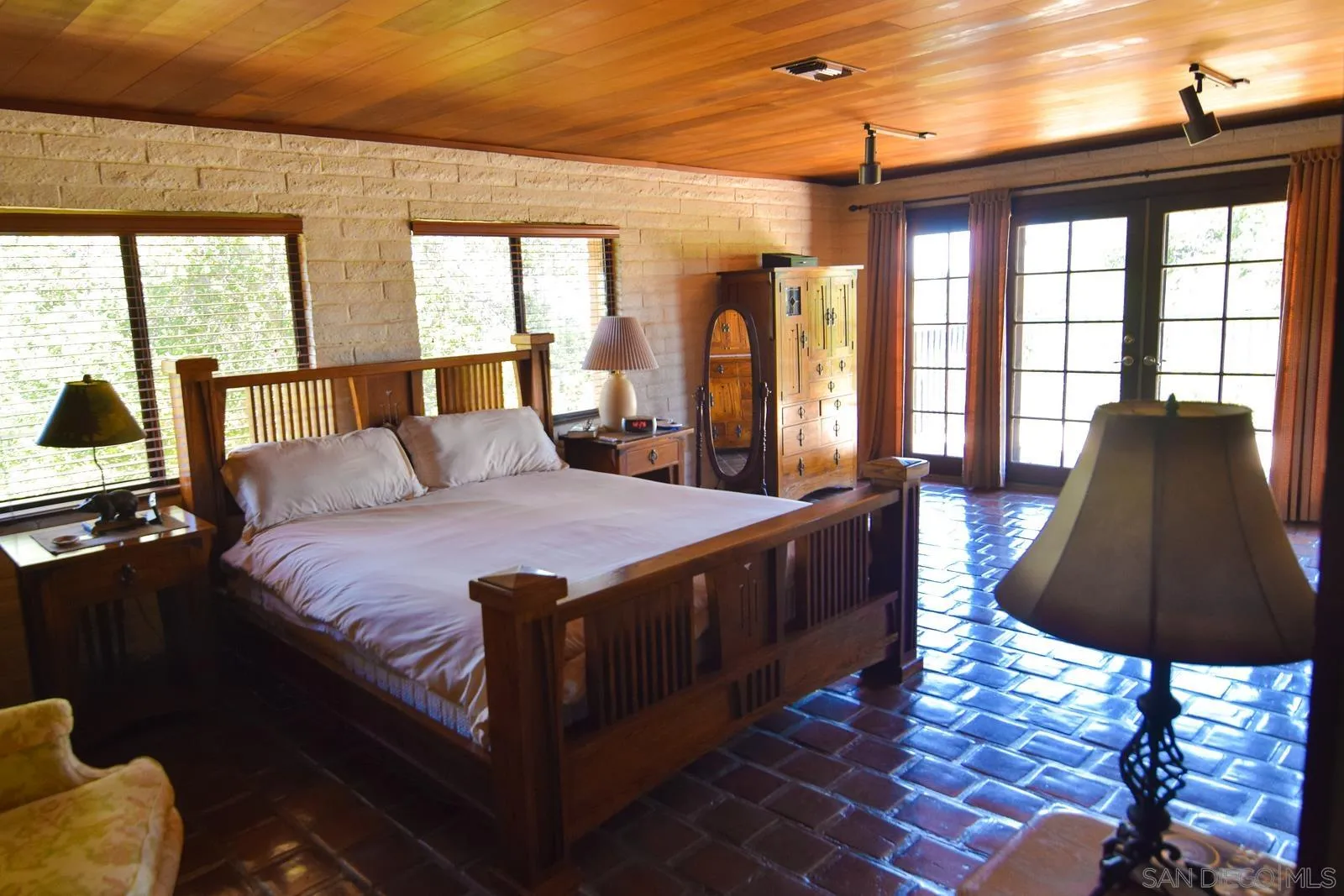 23684 Viejas Grade Road Descanso, CA 91916 - Photo 15 of 54 a large bedroom with wooden floor and a bed