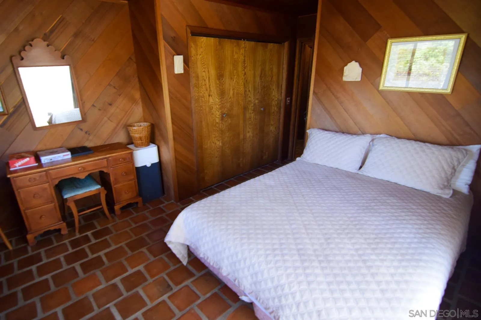 23684 Viejas Grade Road Descanso, CA 91916 - Photo 19 of 54 a bedroom with a bed and a chair in it