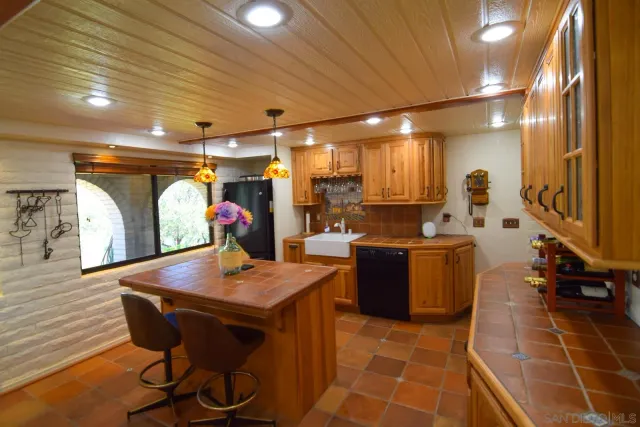 a living room with furniture and a book shelf