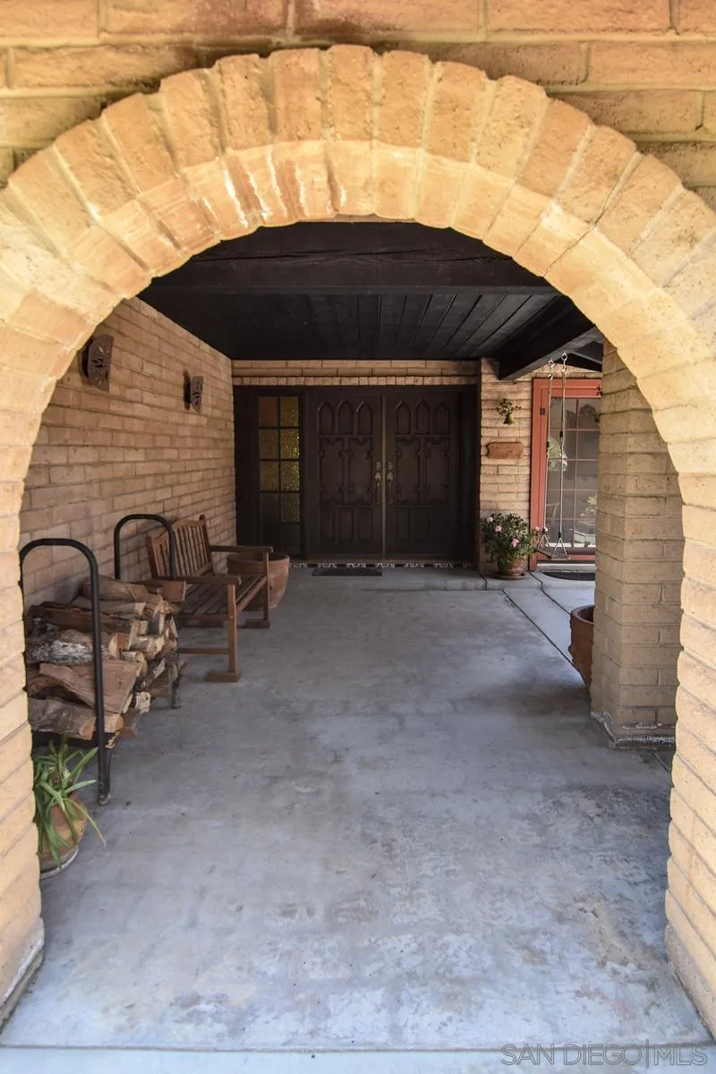 23684 Viejas Grade Road Descanso, CA 91916 - Photo 4 of 54 a backyard of a house with table and chairs