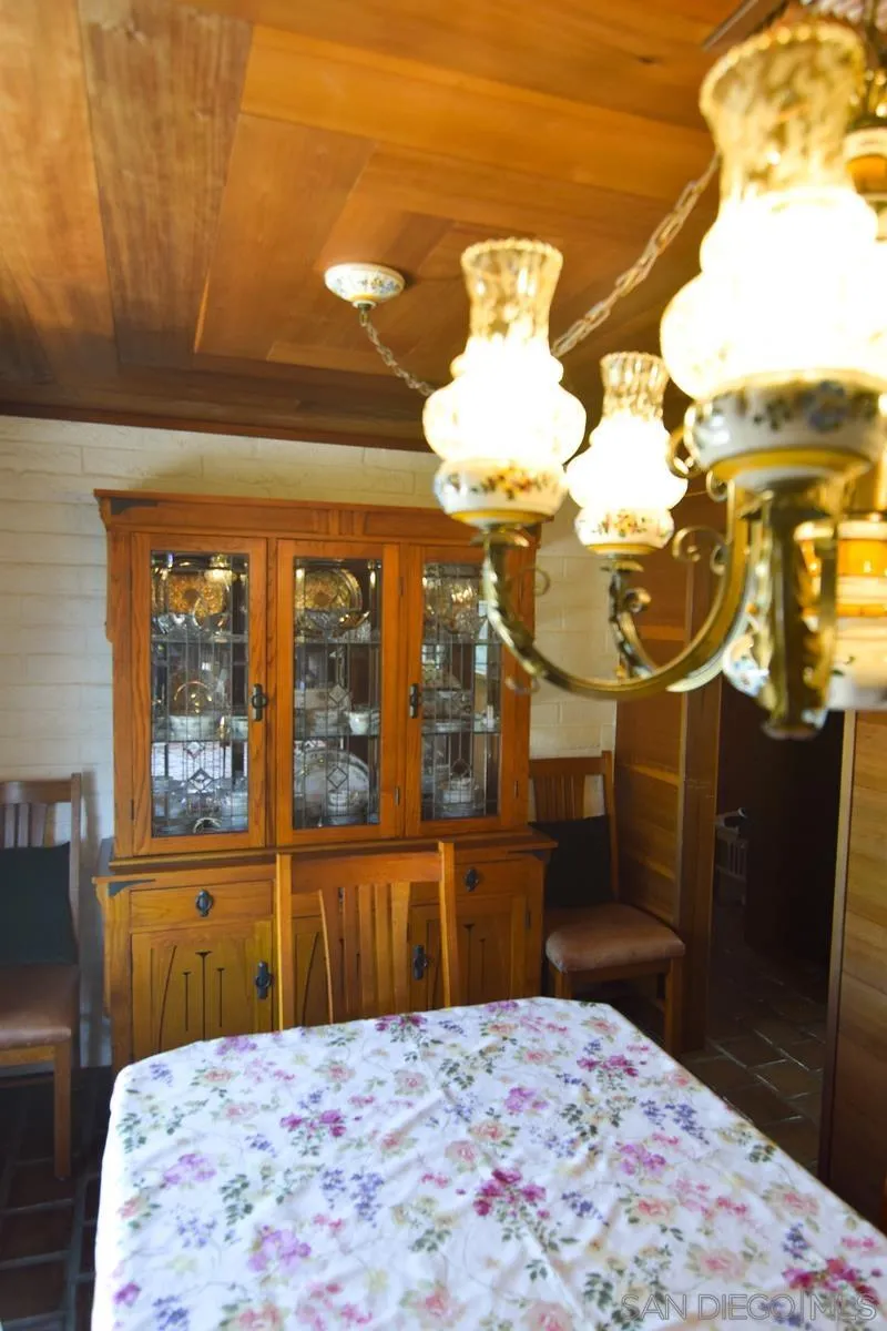 23684 Viejas Grade Road Descanso, CA 91916 - Photo 10 of 54 a bedroom with a bed and wooden floor