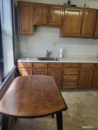 a kitchen with a sink and cabinets