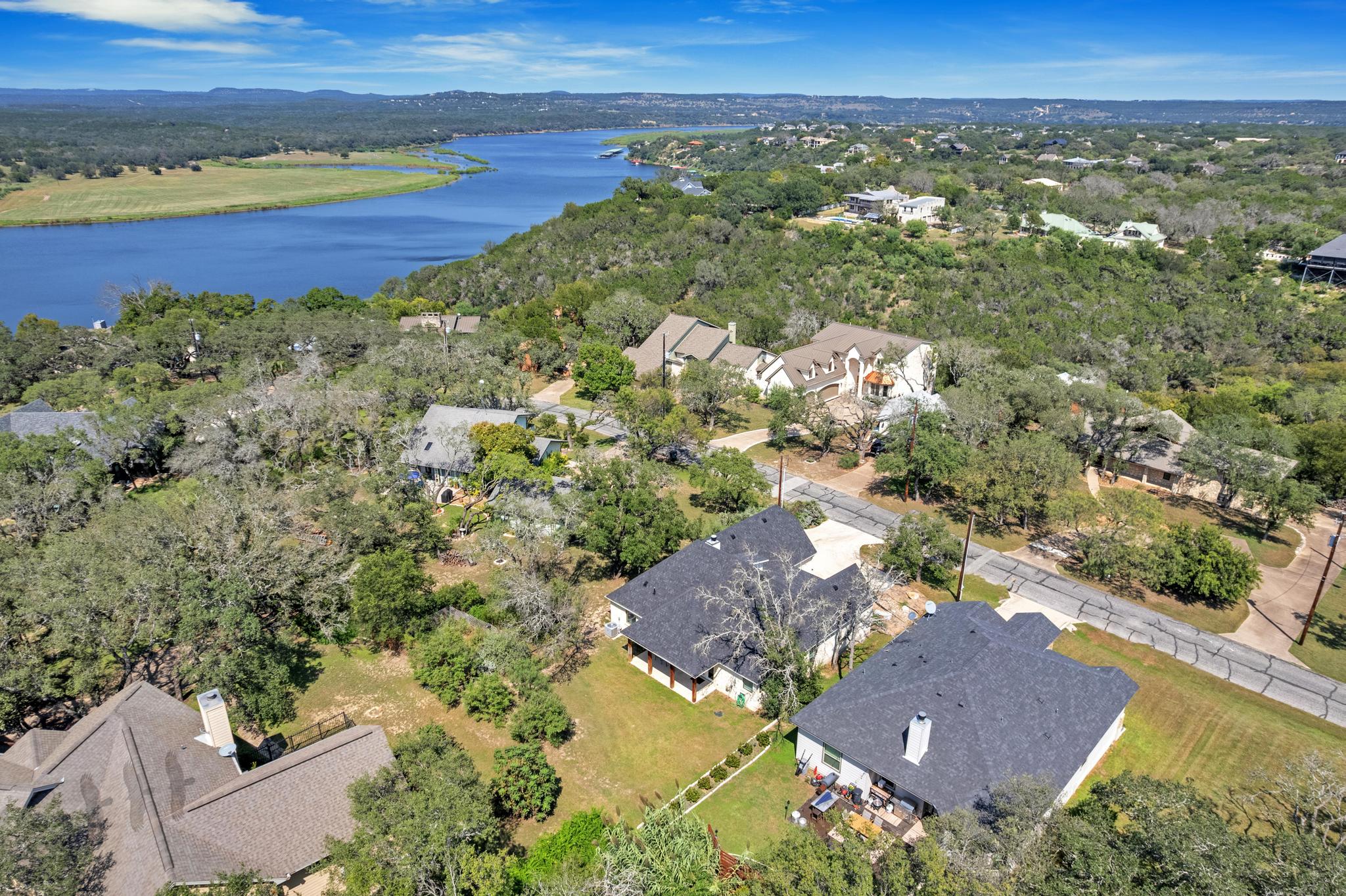 an aerial view of residential houses with outdoor space