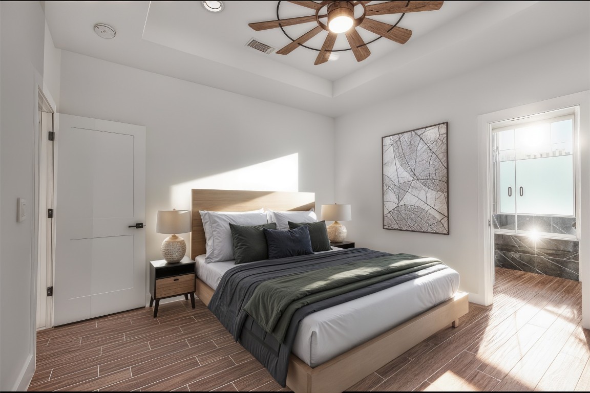 326 Coventry Road Spicewood, TX 78669 - Photo 15 of 30 a bedroom with a large bed and a chandelier