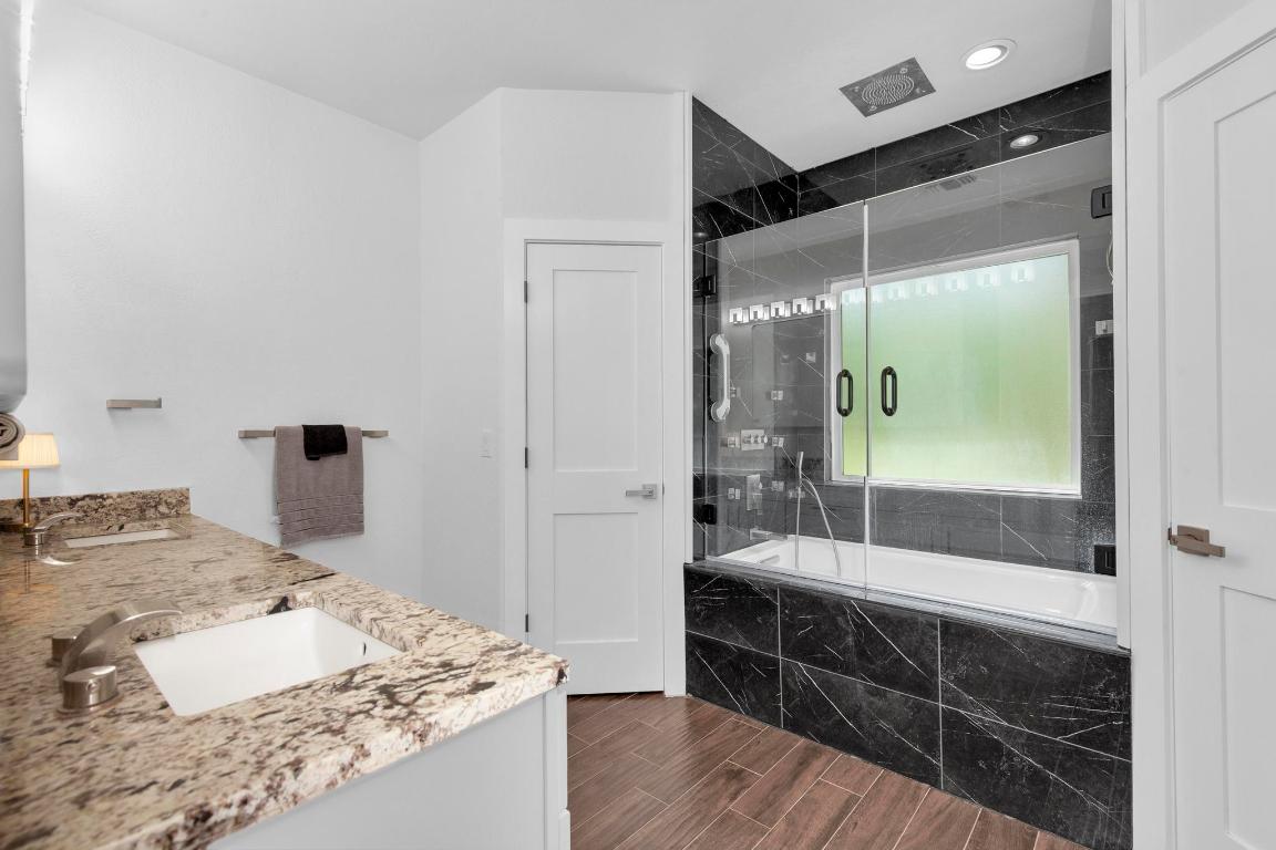 326 Coventry Road Spicewood, TX 78669 - Photo 17 of 30 a bathroom with a sink and a mirror