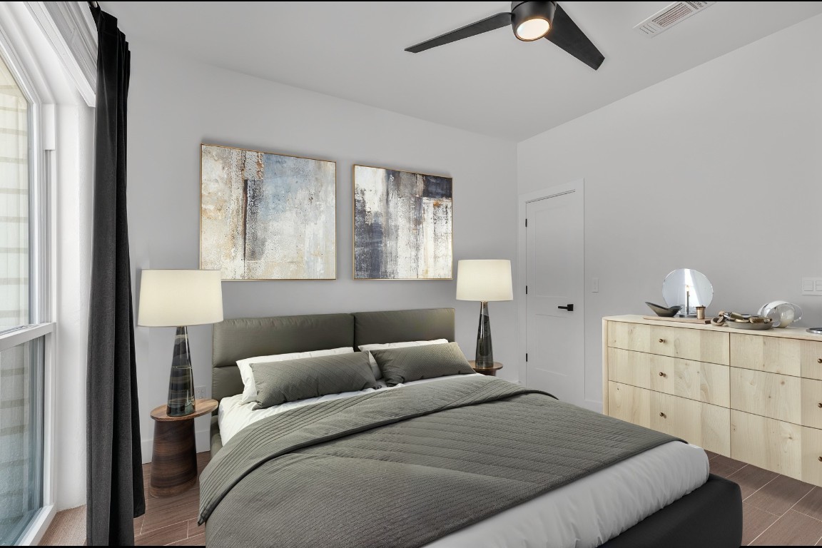 326 Coventry Road Spicewood, TX 78669 - Photo 20 of 30 a bedroom with a bed and window