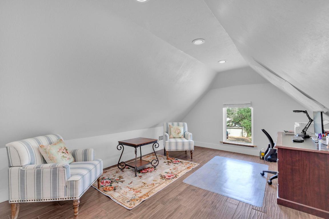 326 Coventry Road Spicewood, TX 78669 - Photo 24 of 30 a living room with furniture and a window