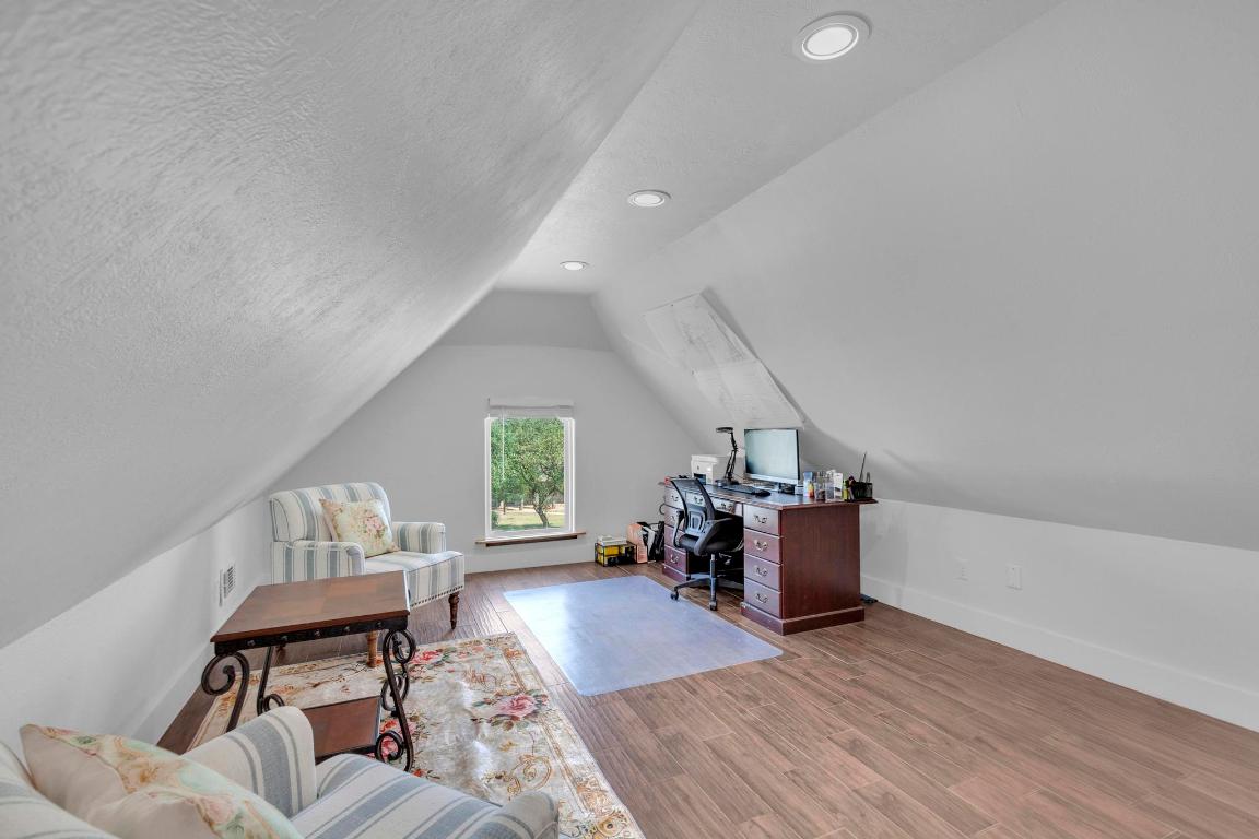326 Coventry Road Spicewood, TX 78669 - Photo 25 of 30 a living room with furniture and wooden floors