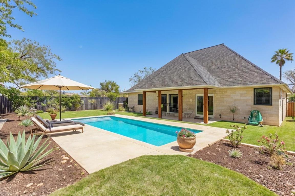 326 Coventry Road Spicewood, TX 78669 - Photo 29 of 30 a front view of a house with swimming pool having outdoor seating