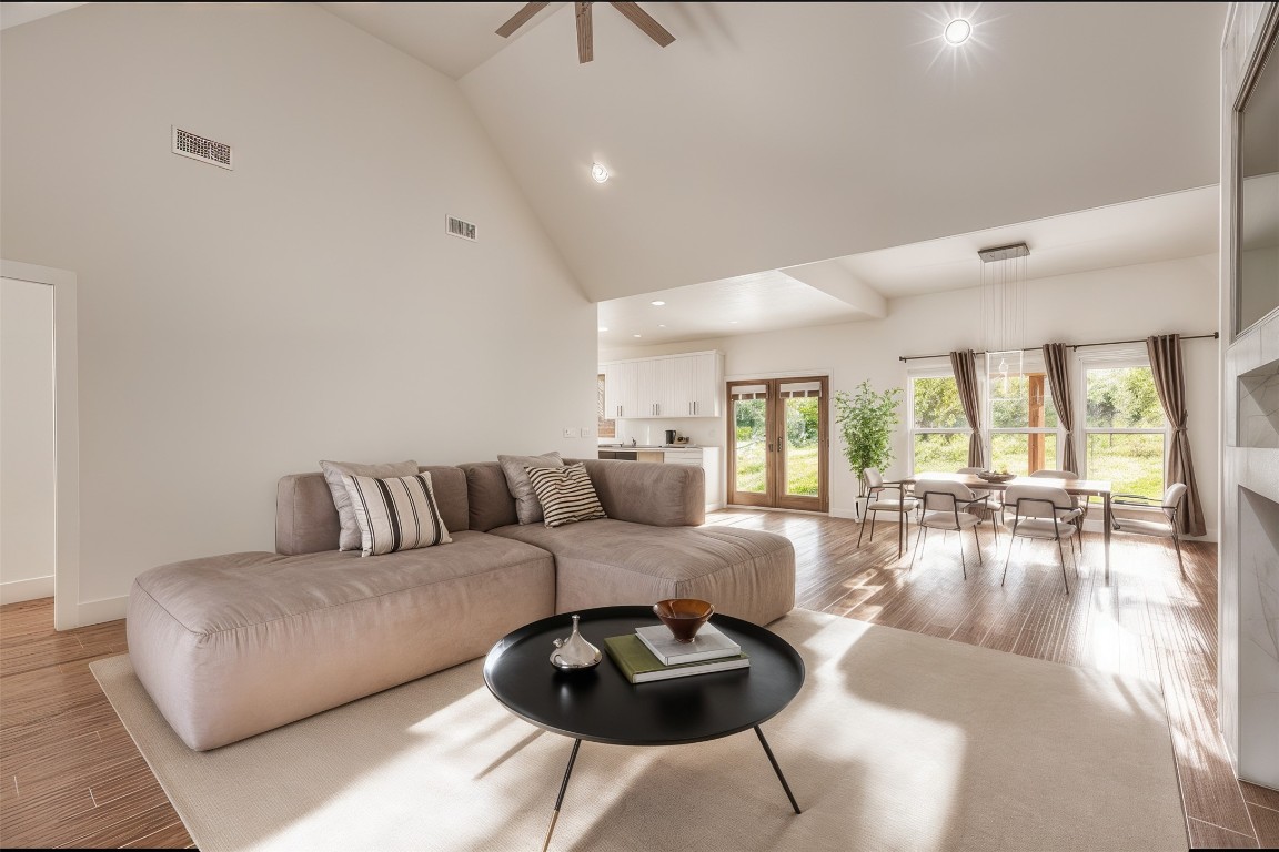 326 Coventry Road Spicewood, TX 78669 - Photo 6 of 30 a living room with furniture and a large window