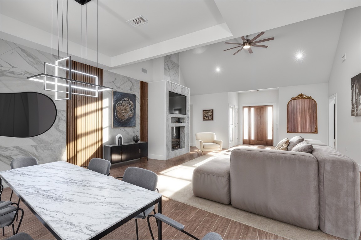 326 Coventry Road Spicewood, TX 78669 - Photo 8 of 30 a living room with furniture a flat screen tv and kitchen view