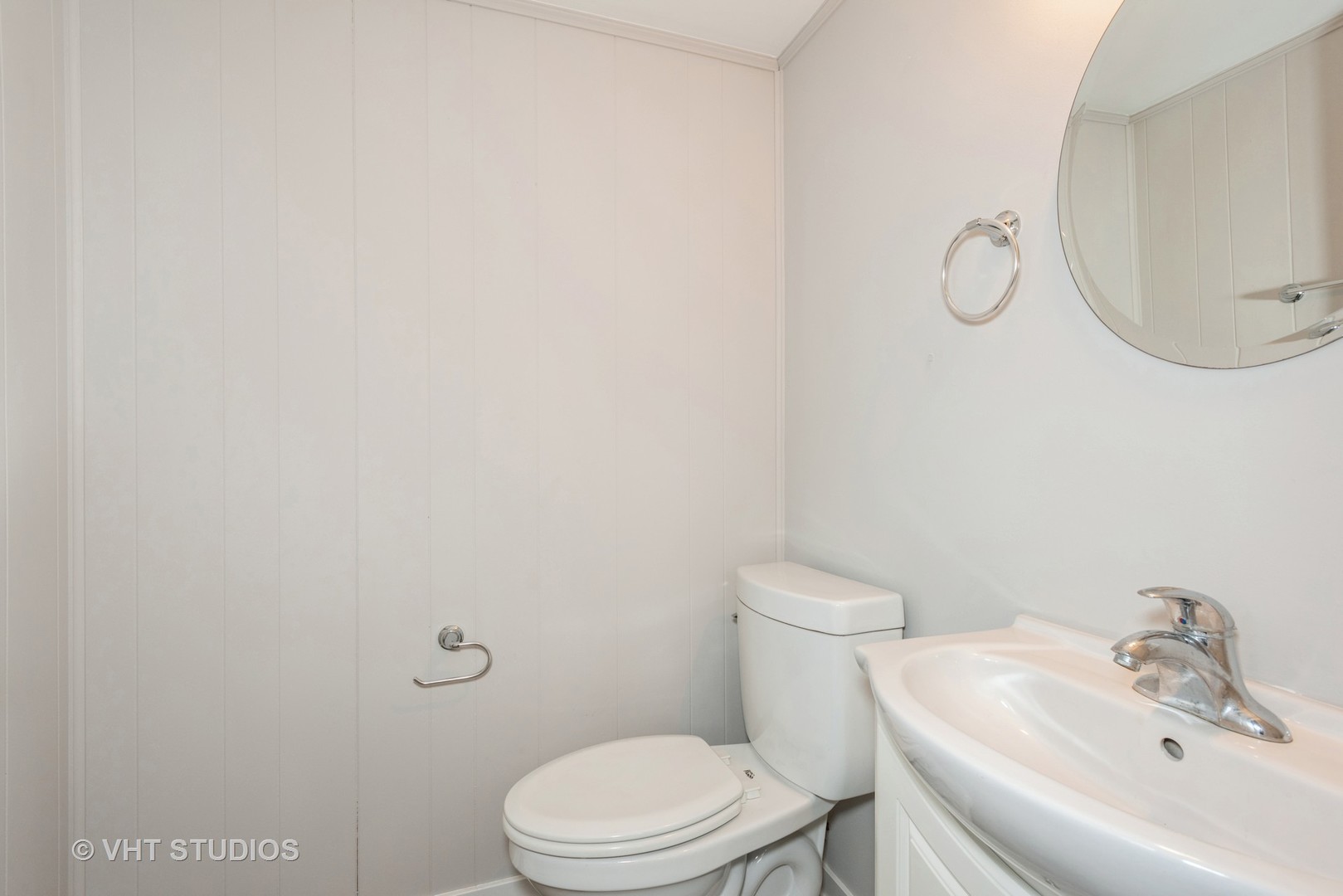 381 Sullivan Road North Aurora, IL 60542 - Photo 14 of 29 a white toilet sitting next to a bathroom sink