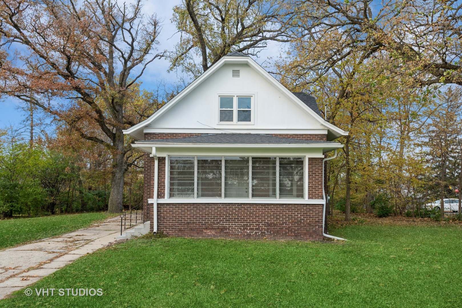 381 Sullivan Road North Aurora, IL 60542 - Photo 2 of 29 a front view of a house with a garden and yard