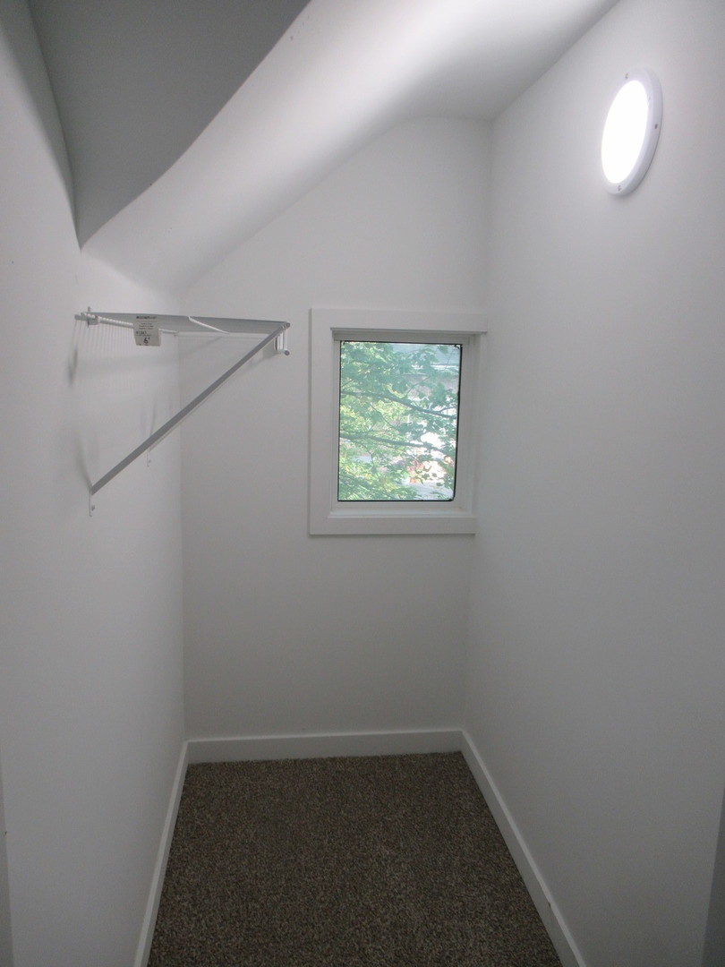 381 Sullivan Road North Aurora, IL 60542 - Photo 22 of 29 an empty room with a window