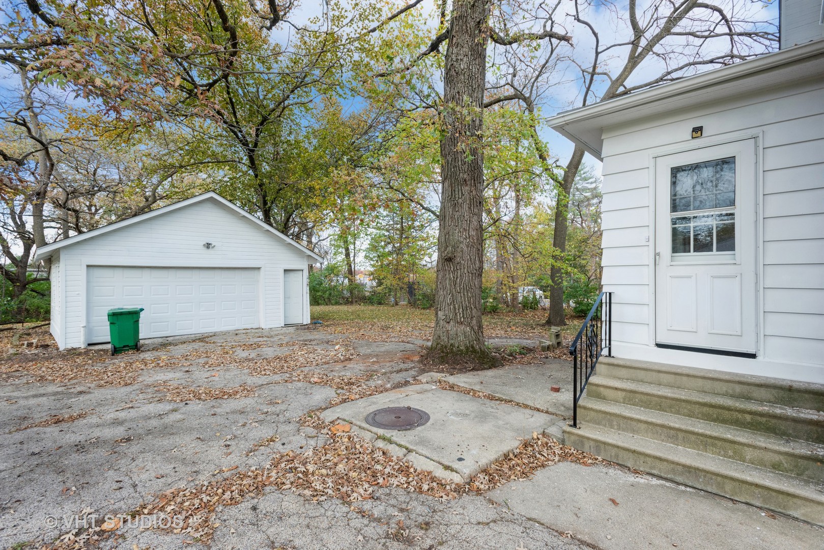 381 Sullivan Road North Aurora, IL 60542 - Photo 4 of 29 a backyard of a house with large trees and a small yard