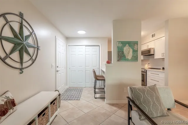 a bedroom with furniture and a chair