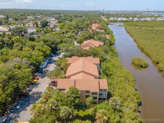an aerial view of a house with a lake view