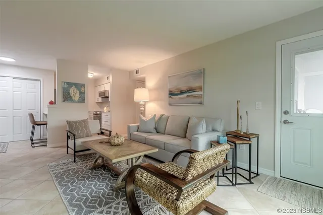 a living room with furniture and a rug