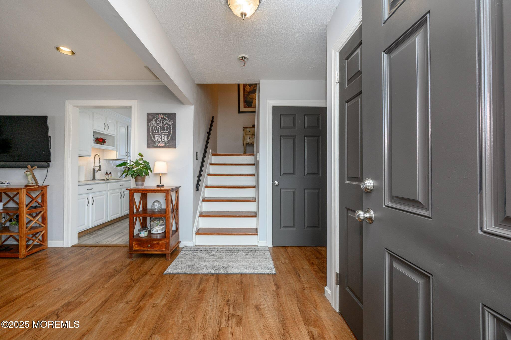 56 Crater Lake Road Howell, NJ 07731 - Photo 3 of 43 a view of entryway with livingroom and wooden floor