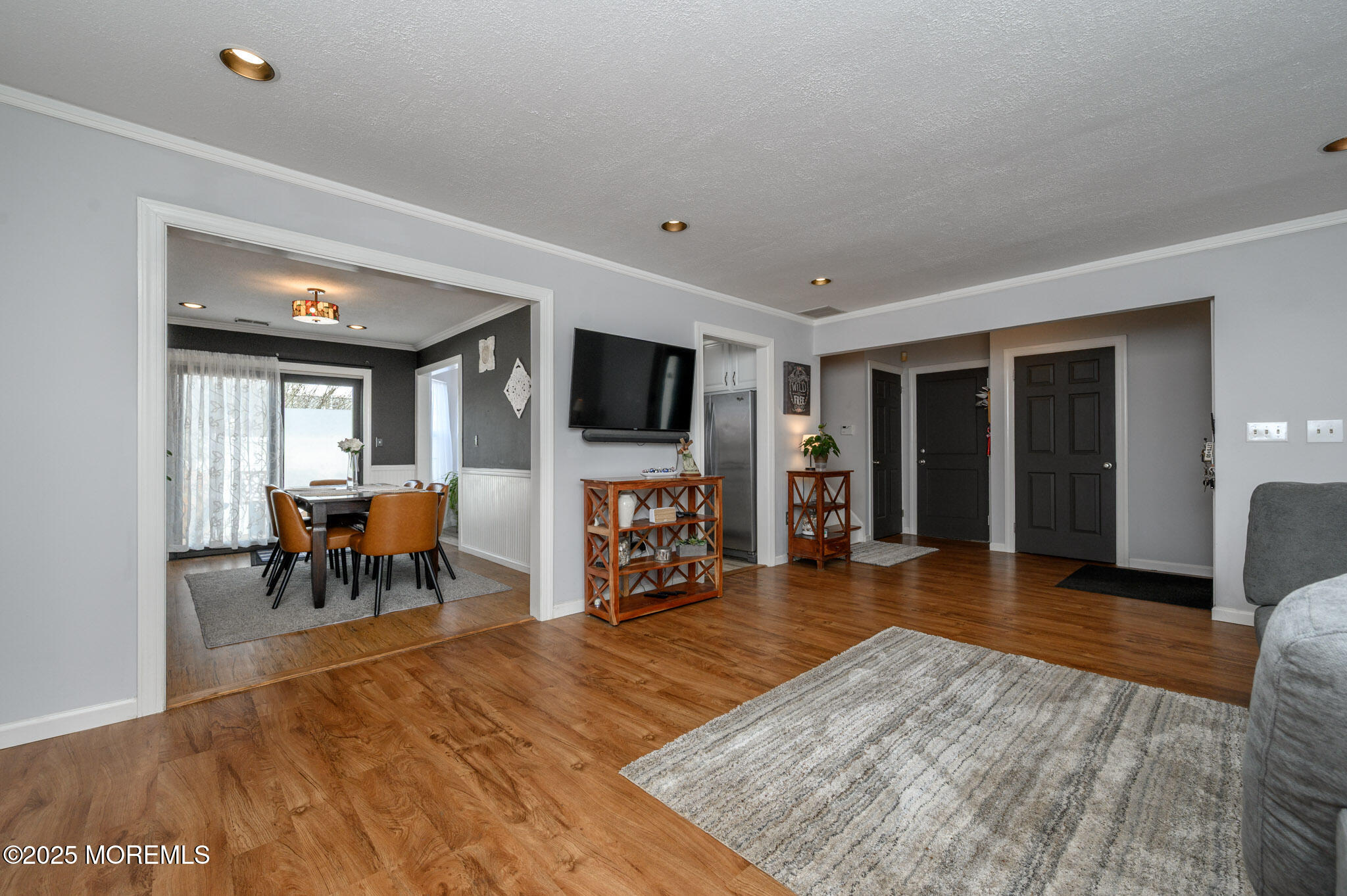 56 Crater Lake Road Howell, NJ 07731 - Photo 6 of 43 a living room with furniture and a flat screen tv