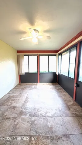 a view of wooden floor in an empty room