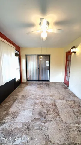 a view of an empty room and window