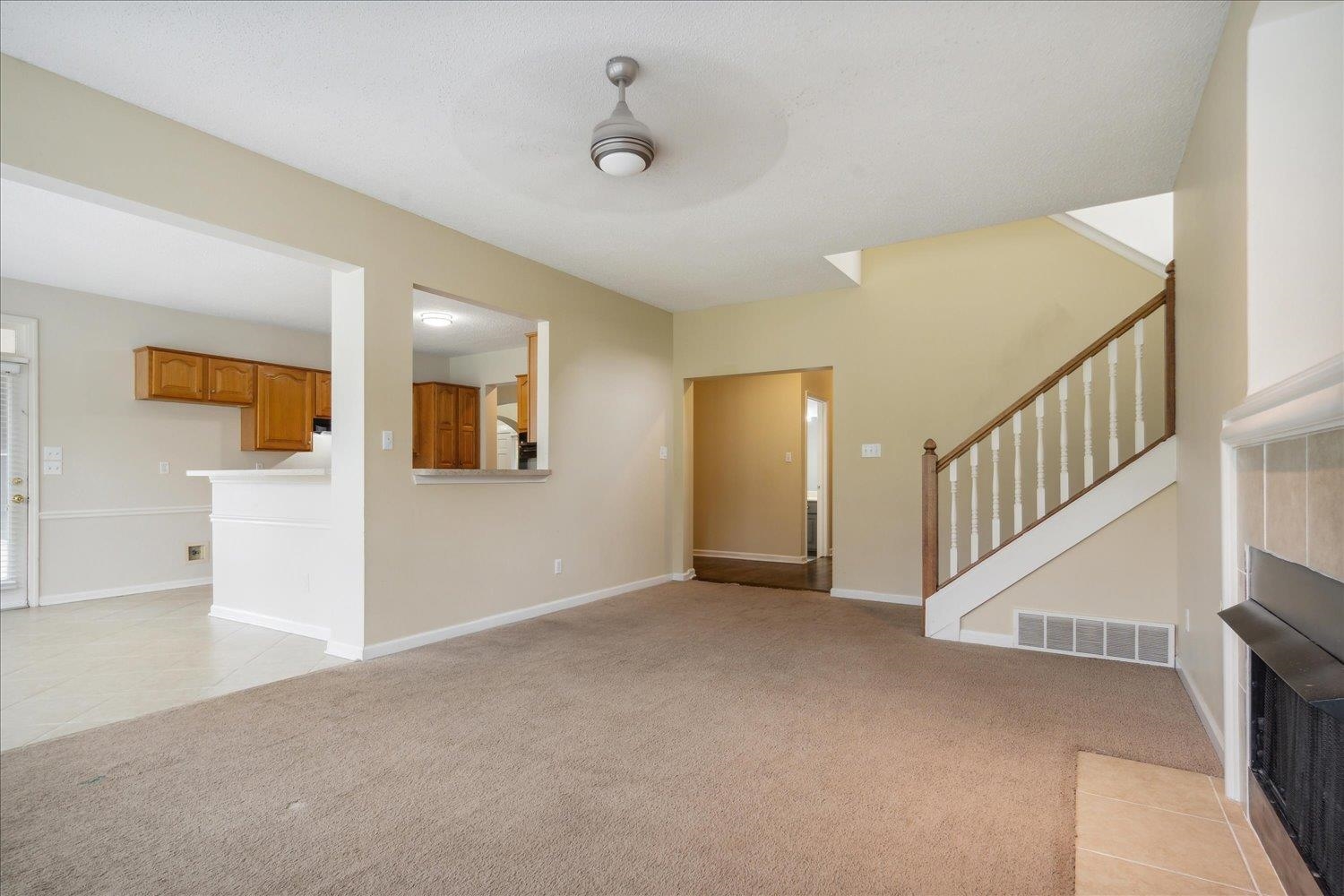 8817 Dexter Road Memphis, TN 38016 - Photo 17 of 34 Unfurnished living room featuring light carpet and ceiling fan