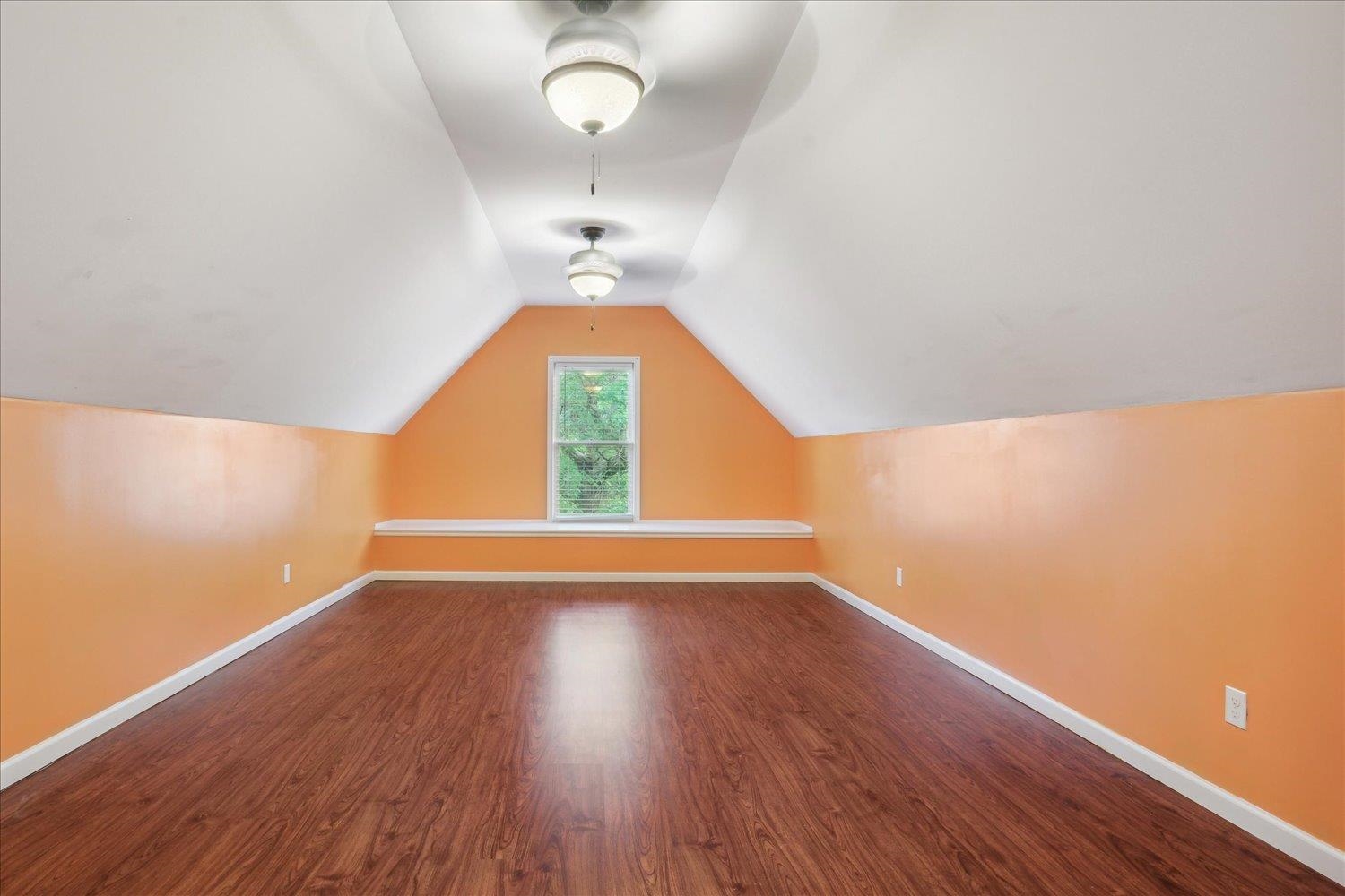 8817 Dexter Road Memphis, TN 38016 - Photo 25 of 34 Bonus room featuring vaulted ceiling and wood-type flooring