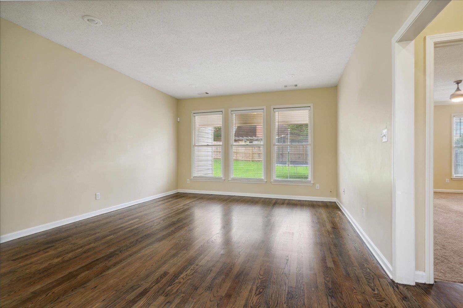 8817 Dexter Road Memphis, TN 38016 - Photo 8 of 34 Empty room featuring dark hardwood / wood-style flooring