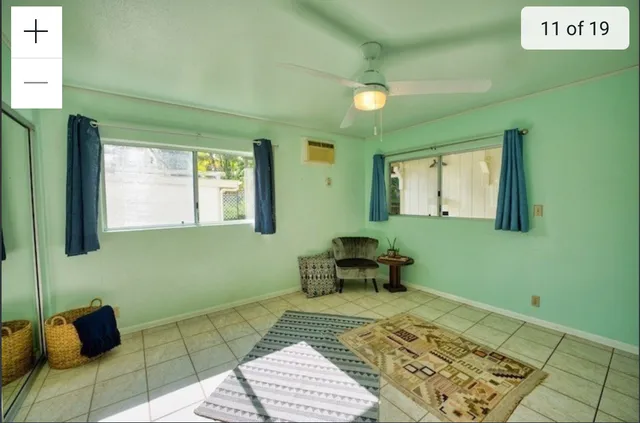 a living room with furniture and a rug