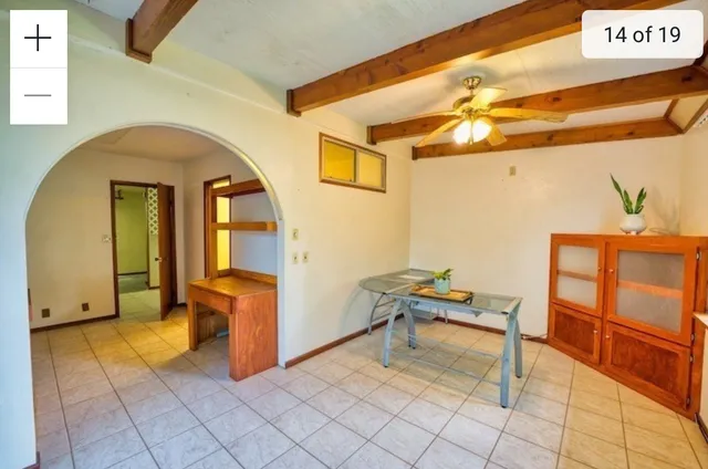 a bathroom with a sink and mirror with toilet