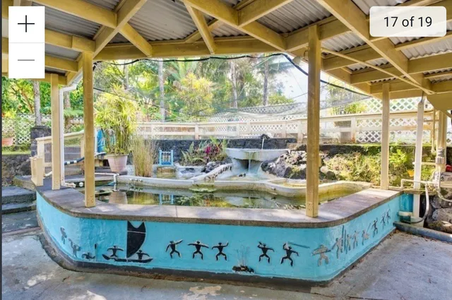 a view of swimming pool with outdoor seating